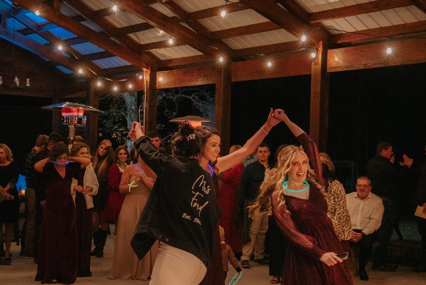 Reception celebration under warm lights.