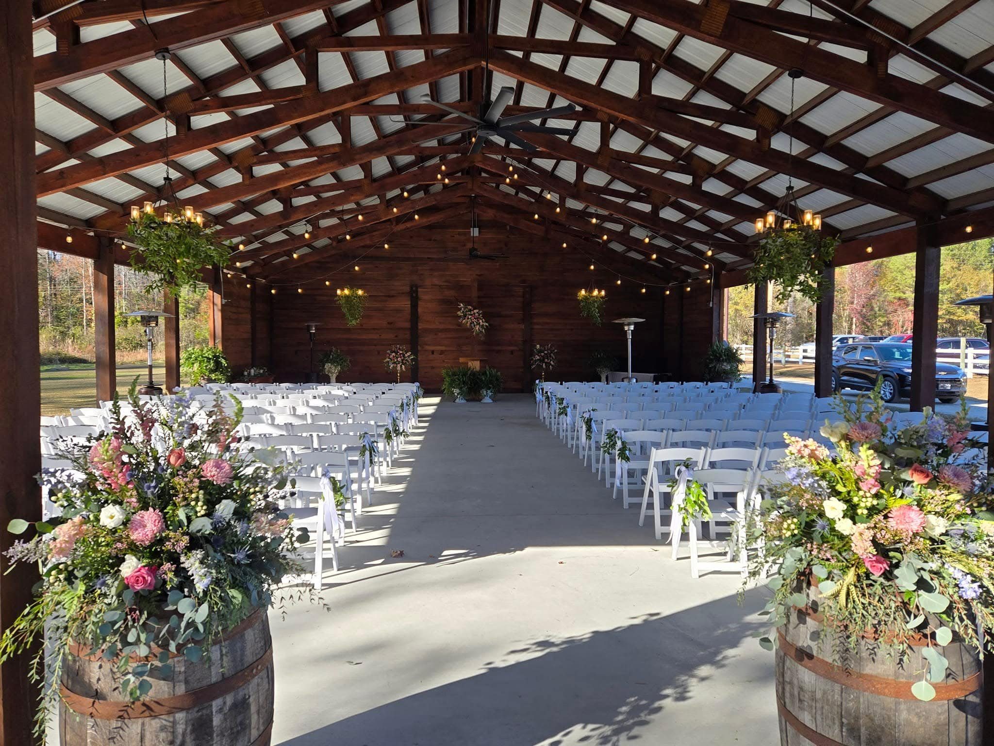 Ceremony seating beneath the covered pavilion at The Horse Barn.
